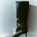 Women's black high shine leather knee high boot with stiletto heel and sharp pointed toe