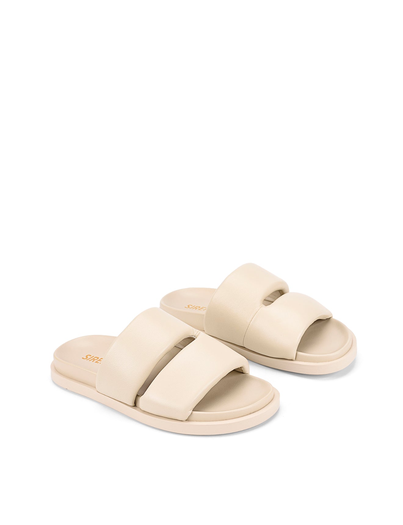 Women's beige leather footbed slide with puffy vamp upper