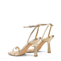 Women's high heel stiletto sandal in gold metallic leather